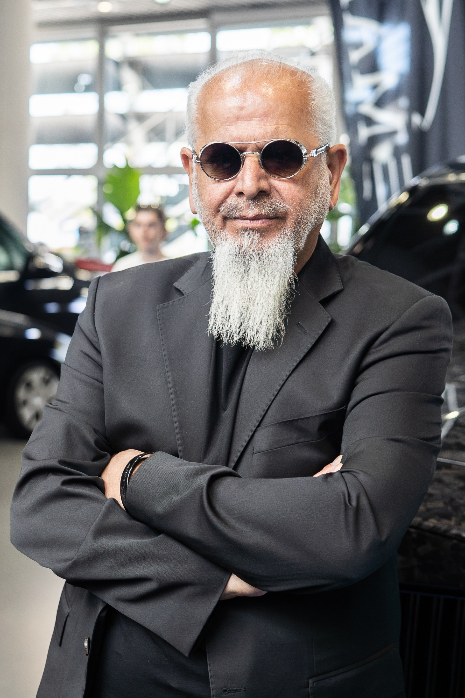 Kourosh Mansory wearing a dark jacket and sunglasses