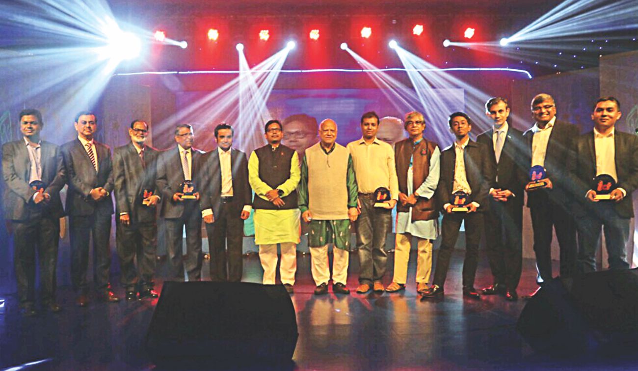 M Rezaul Hassan, second from right, holding his award alongside fellow recipients and guests at the 2017 ICT Awards in Dhaka