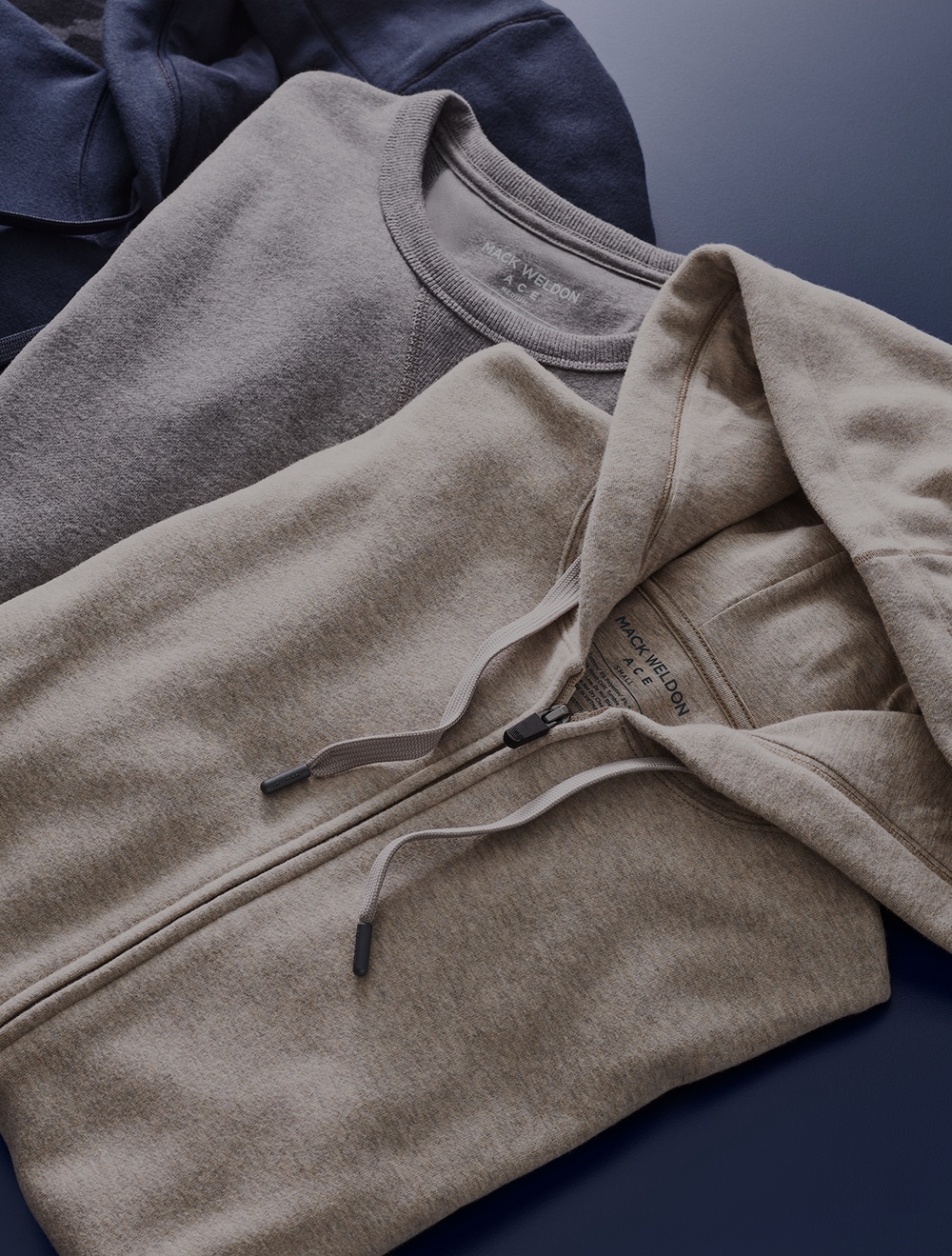 Mack Weldon knitwear arranged in a flat lay