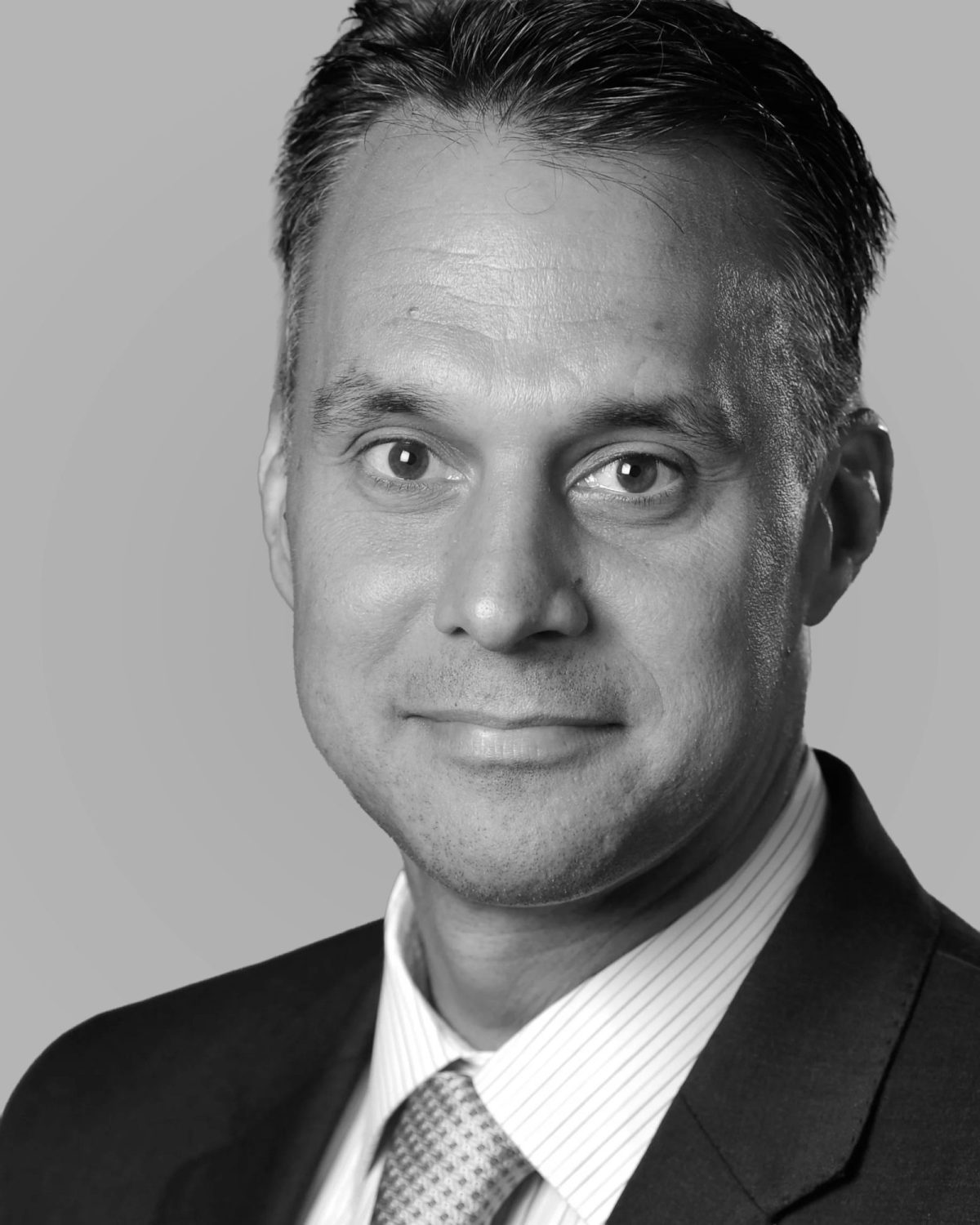 Black-and-white portrait of MAD Global Strategy founder and CEO Mike DuHaime