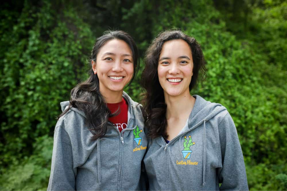 Mon Ami co-founders Joy Zhang and Madeline Dangerfield-Cha standing together outdoors