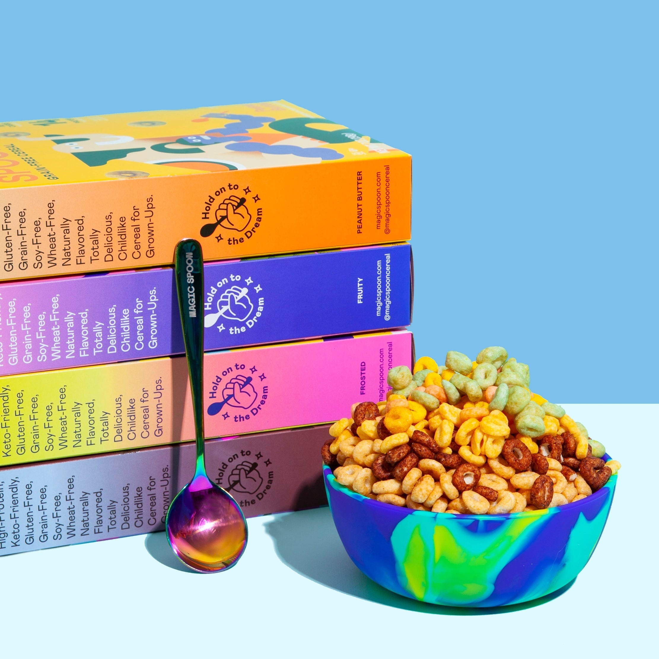 A stack of brightly colored Magic Spoon cereal boxes