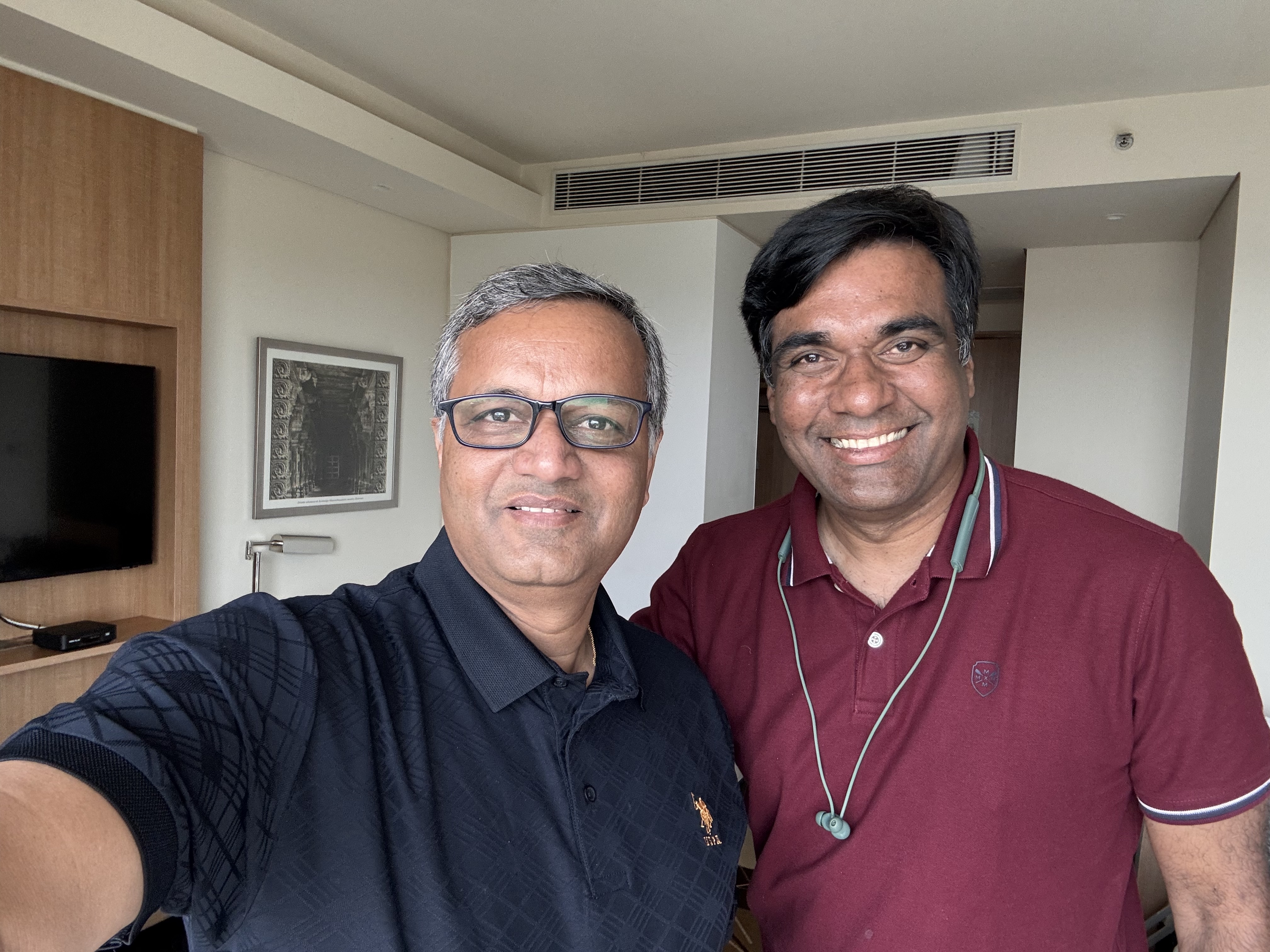 Mahesh Baxi, left, taking a photograph with Kiruba Shankar