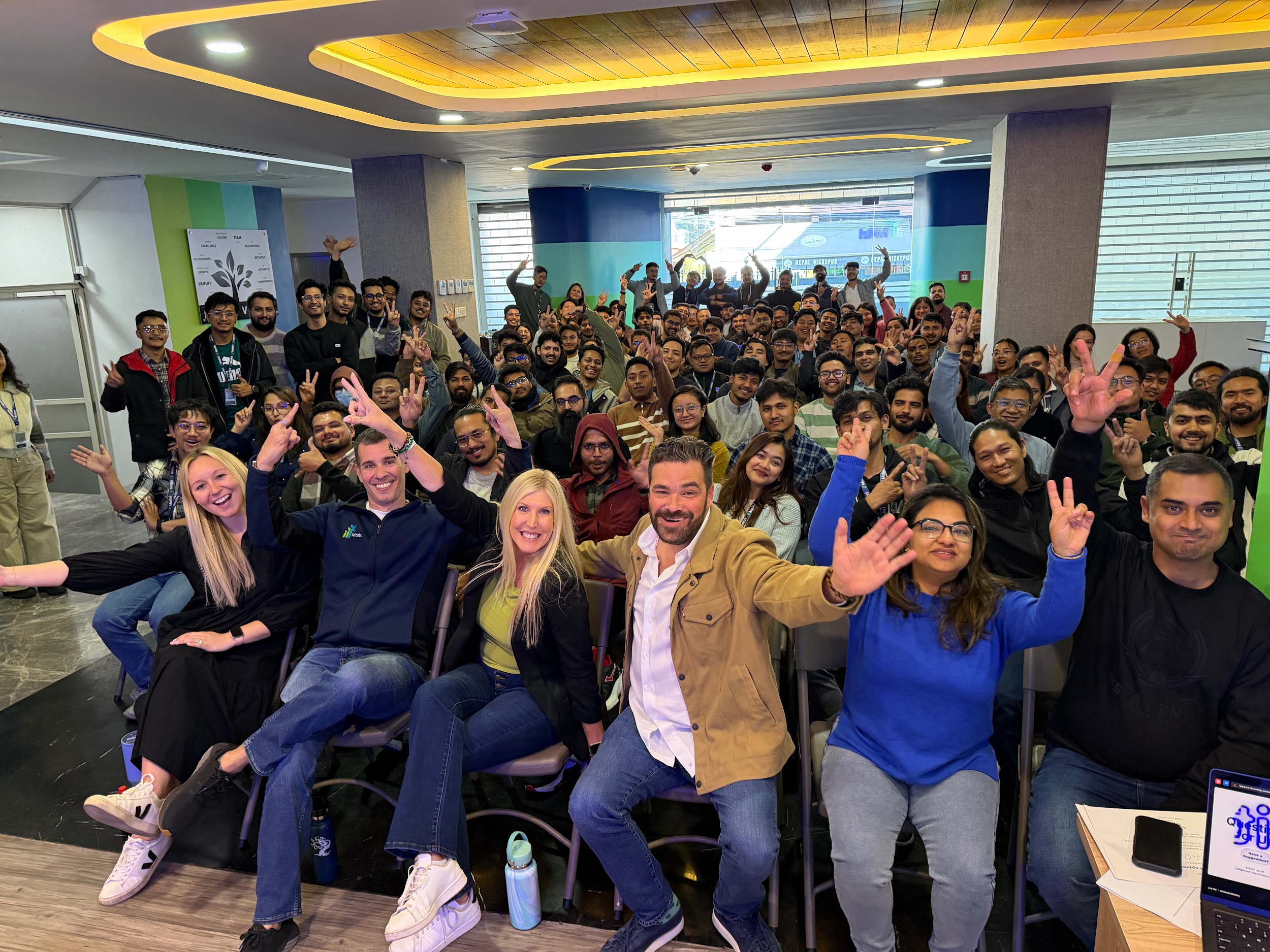 Maitri colleagues gathered at a company all-hands