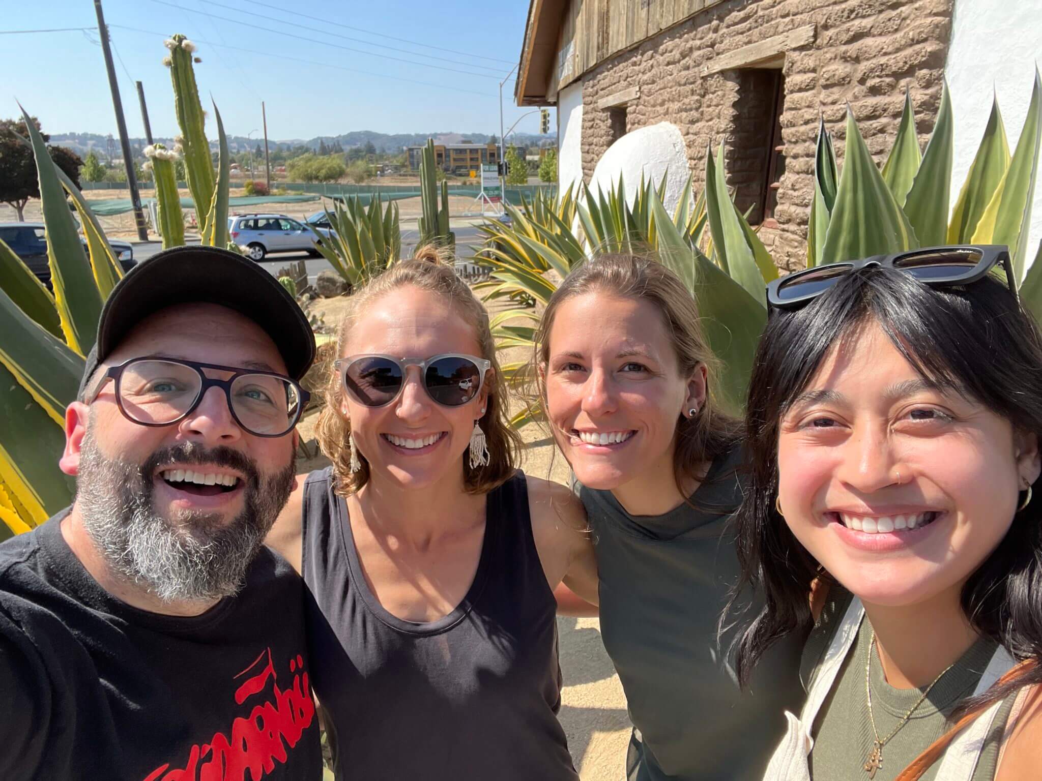 Andrew Boardman, Maiya Holliday, Megan Yarnall and Marie Koesnodihardjo smiling together outdoors