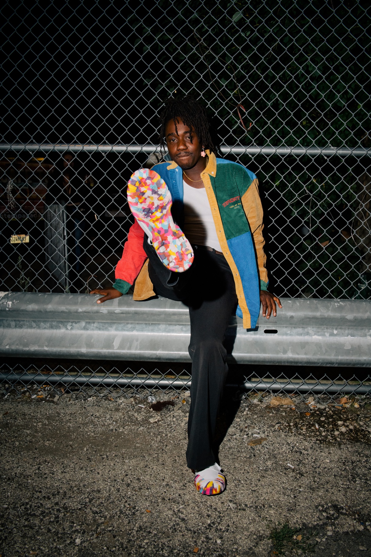 Rapper Ric Wilson posing with the colorful sole of a Vans shoe at an activation