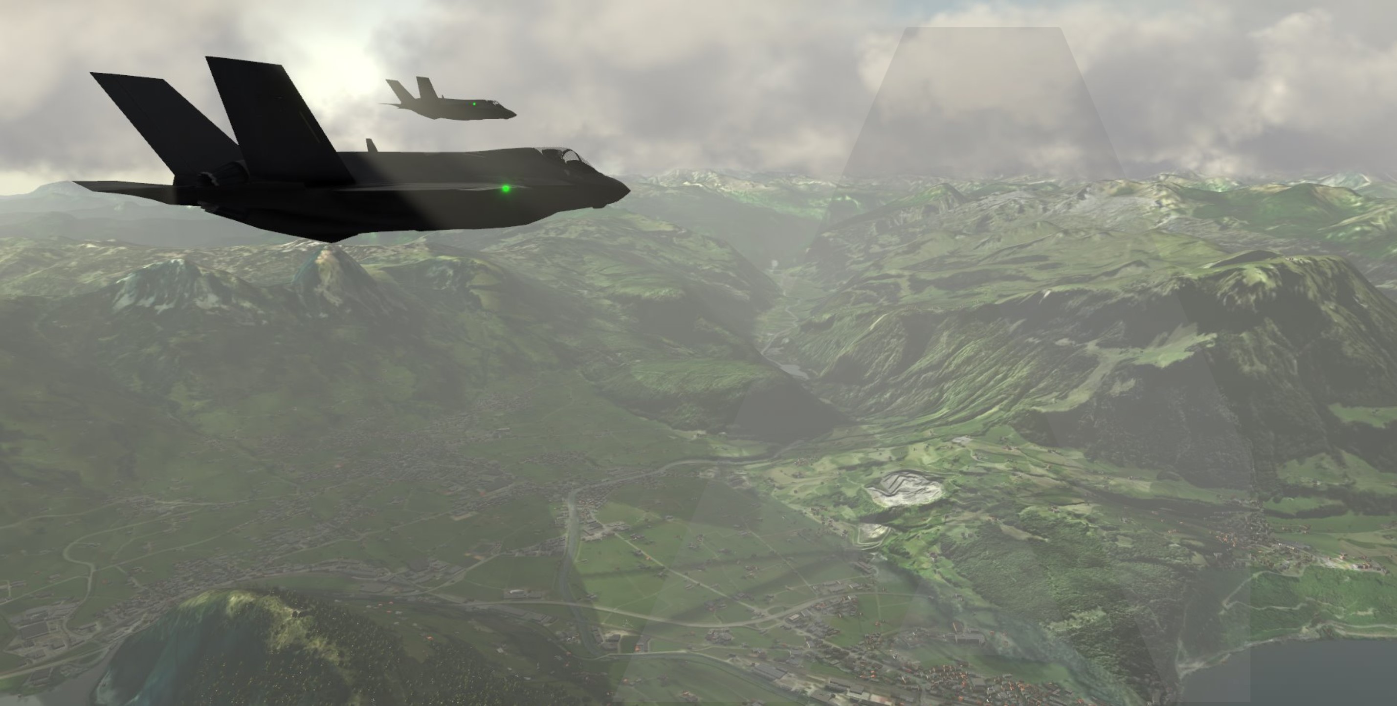 MAK synthetic environment showing two military aircraft above mountainous terrain