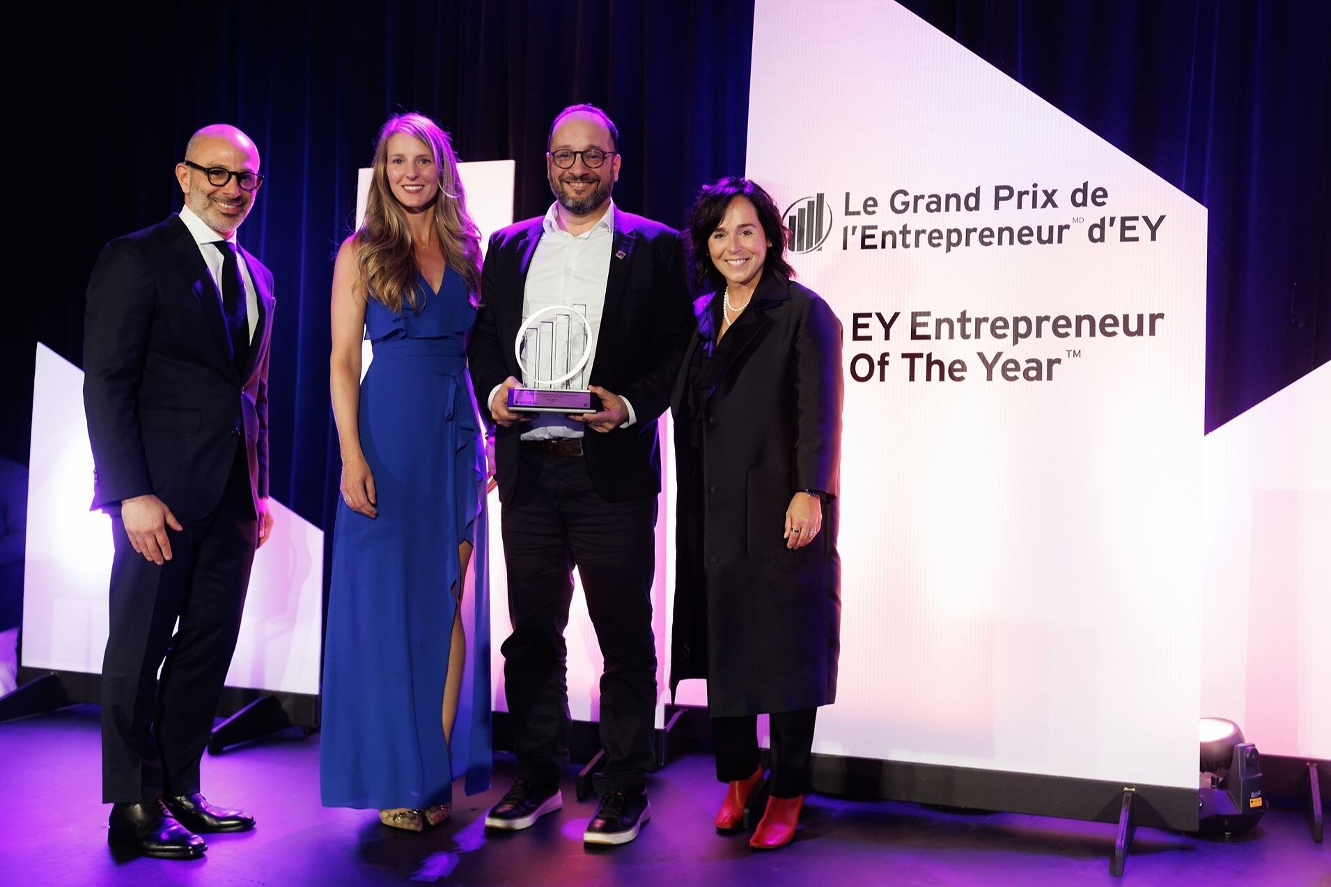 Malik Yacoubi holds his EY award beside Walid Safi, Audrey Gibeault and Linda Williams.