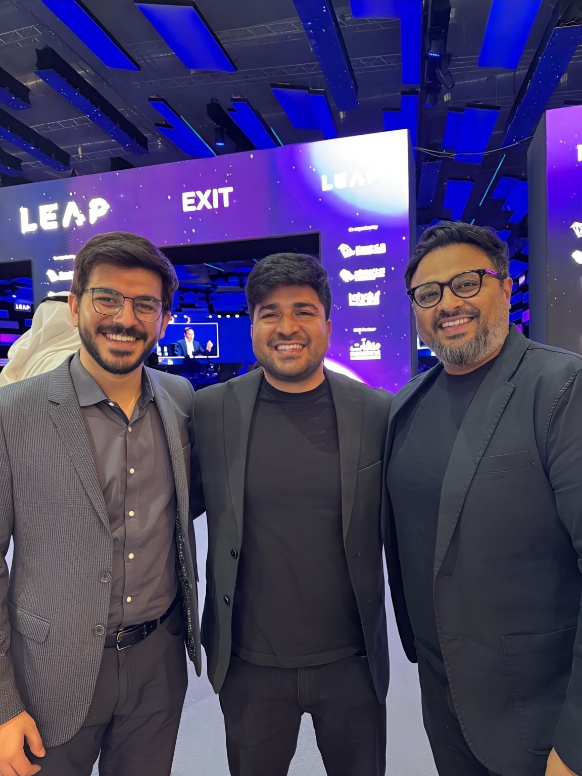Mandeep Singh, center, with two Tru colleagues at LEAP 2025