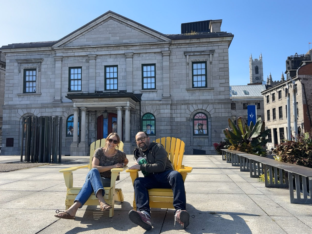 Maiya Holliday and Andrew Boardman seated in yellow chairs in Old Montreal