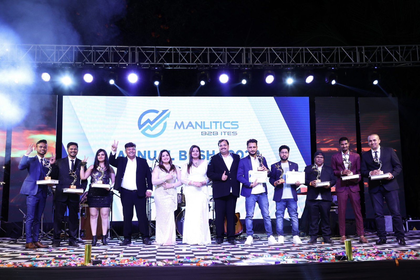 Award recipients and colleagues onstage at a Manlitics annual celebration