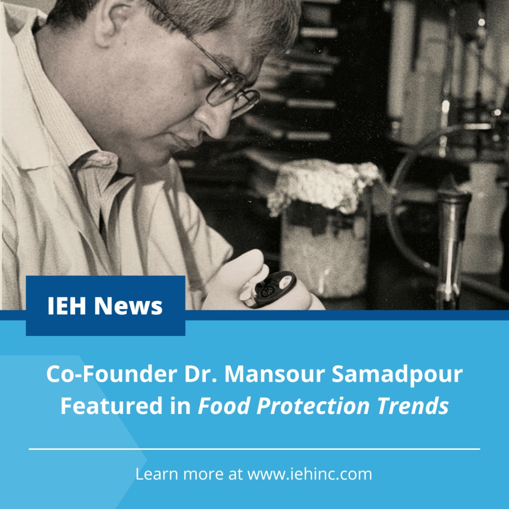 A younger Mansour Samadpour examines laboratory material while holding a pipette controller.