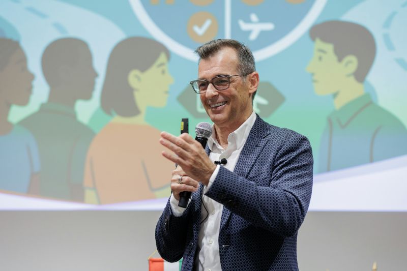 Manuel Schiappa Pietra speaking onstage at the Global Impact Summit
