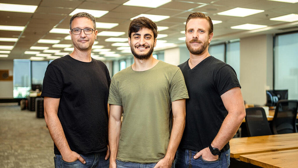 Explorium co-founders Omer Har, Maor Shlomo and Or Tamir standing together in their office