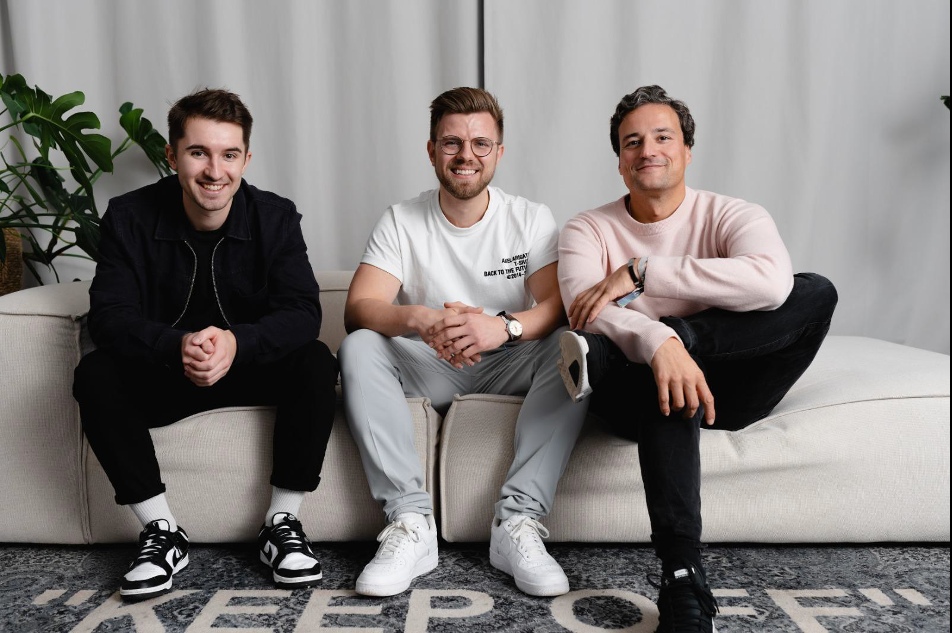 Julian Rauch, Marc-Niclas Janz and Marcus Diekmann seated together on a sofa