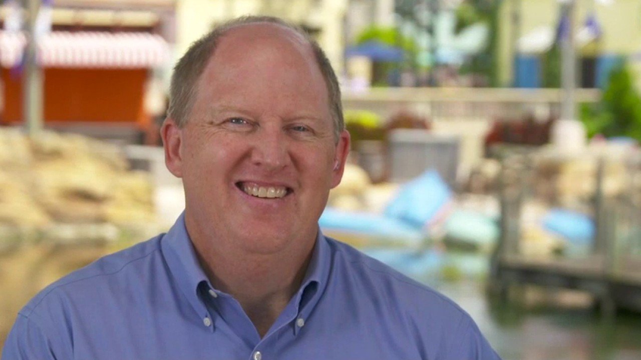 Marc Swanson speaking on camera at a theme park in 2020