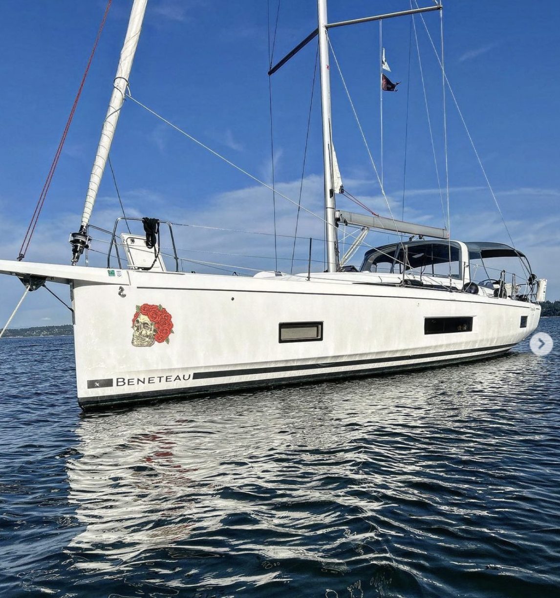 Run for the Roses anchored off Blake Island, with its rose emblem visible on the hull