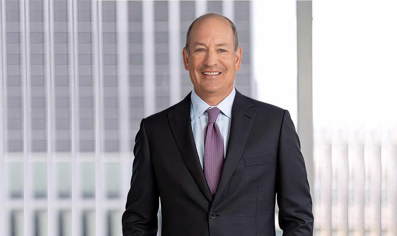 Marc Wolpow in a suit and tie in a published press photograph