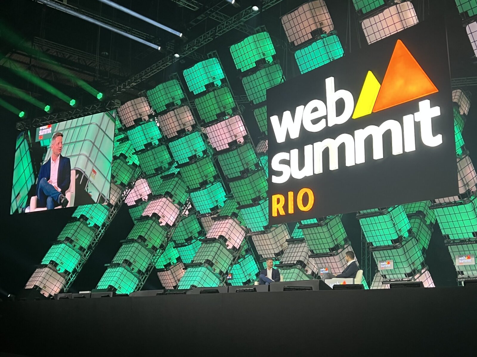 Marcelo Cortes in conversation on the large Web Summit Rio stage in 2023