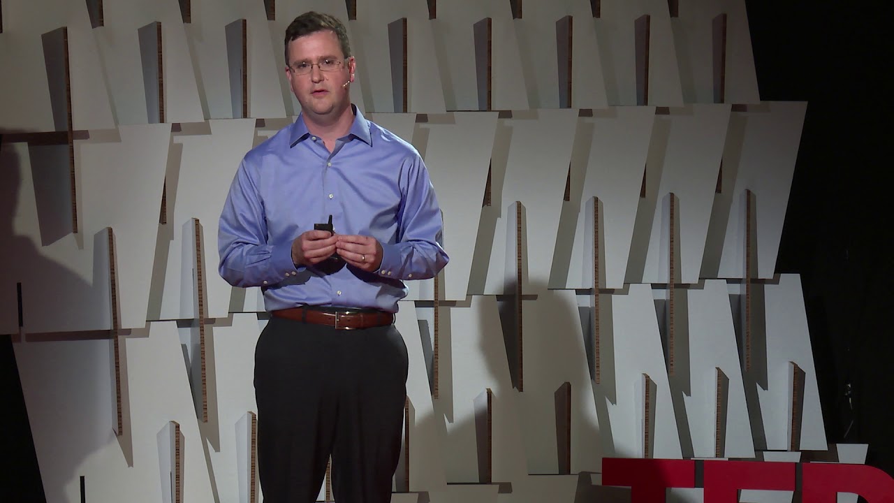 Marcus Quigley speaking on the TEDxBeaconStreet stage