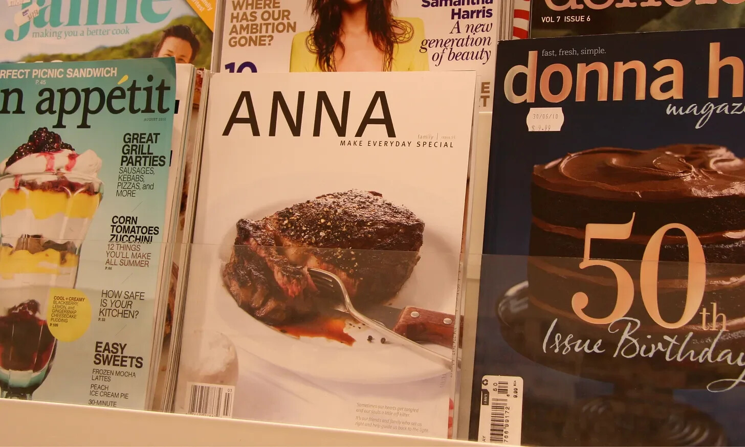 ANNA Magazine displayed on a newsstand among other food and lifestyle magazines