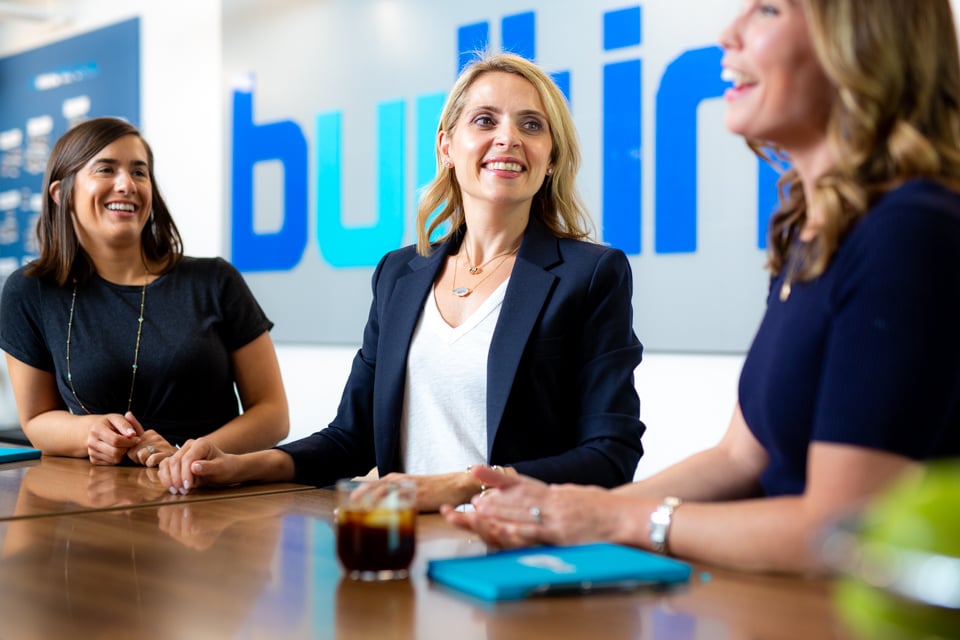 Maria Christopoulos Katris, center, in conversation with two Built In colleagues