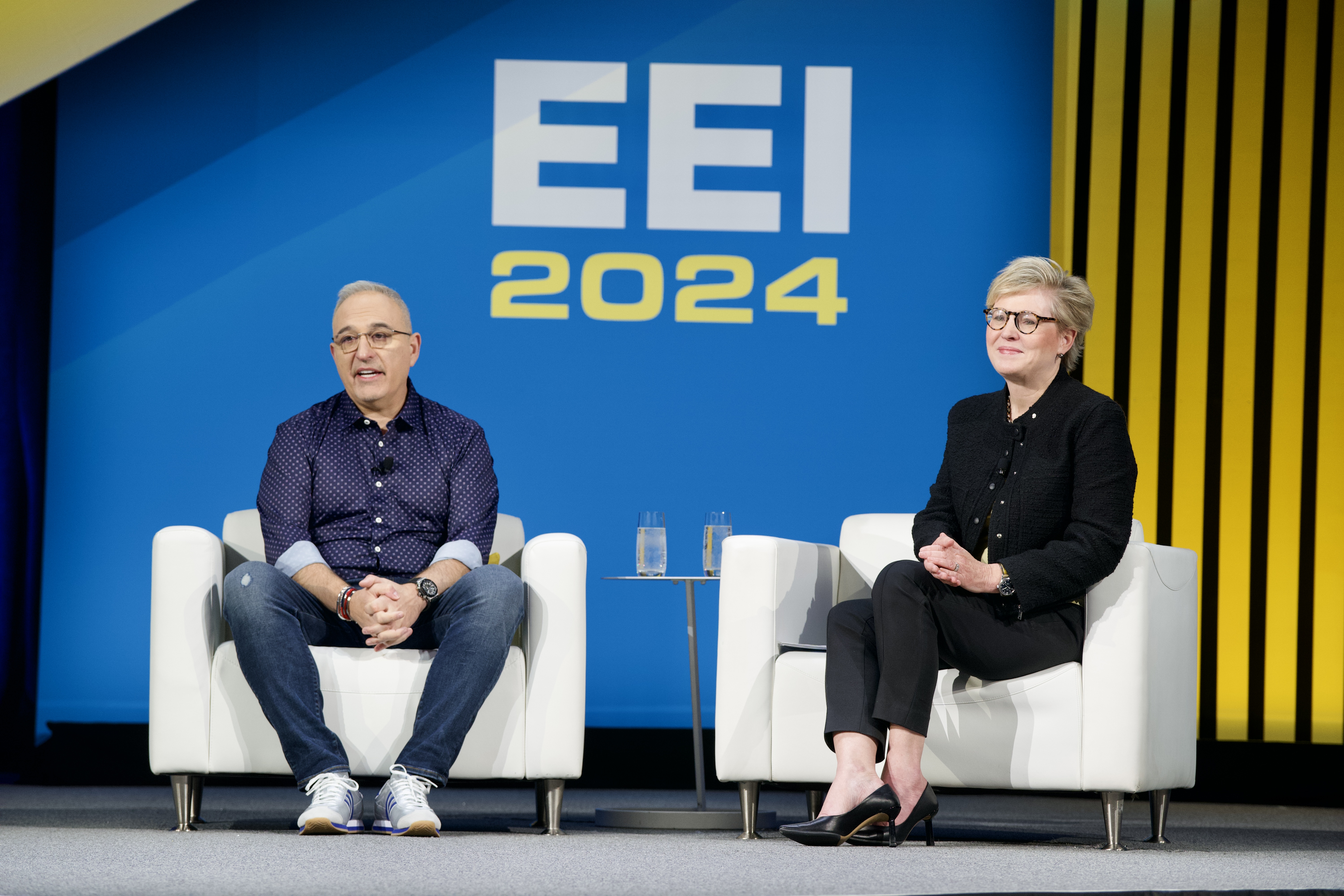 Antonio Neri and Maria Pope seated on stage at EEI 2024