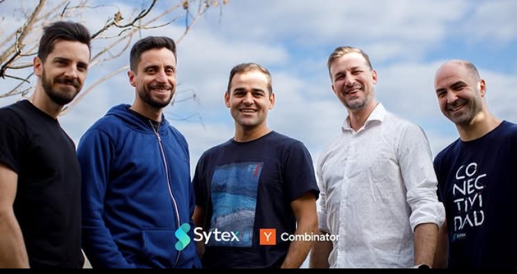 Mariano Lisiotti, center, standing with the Sytex founding team outdoors