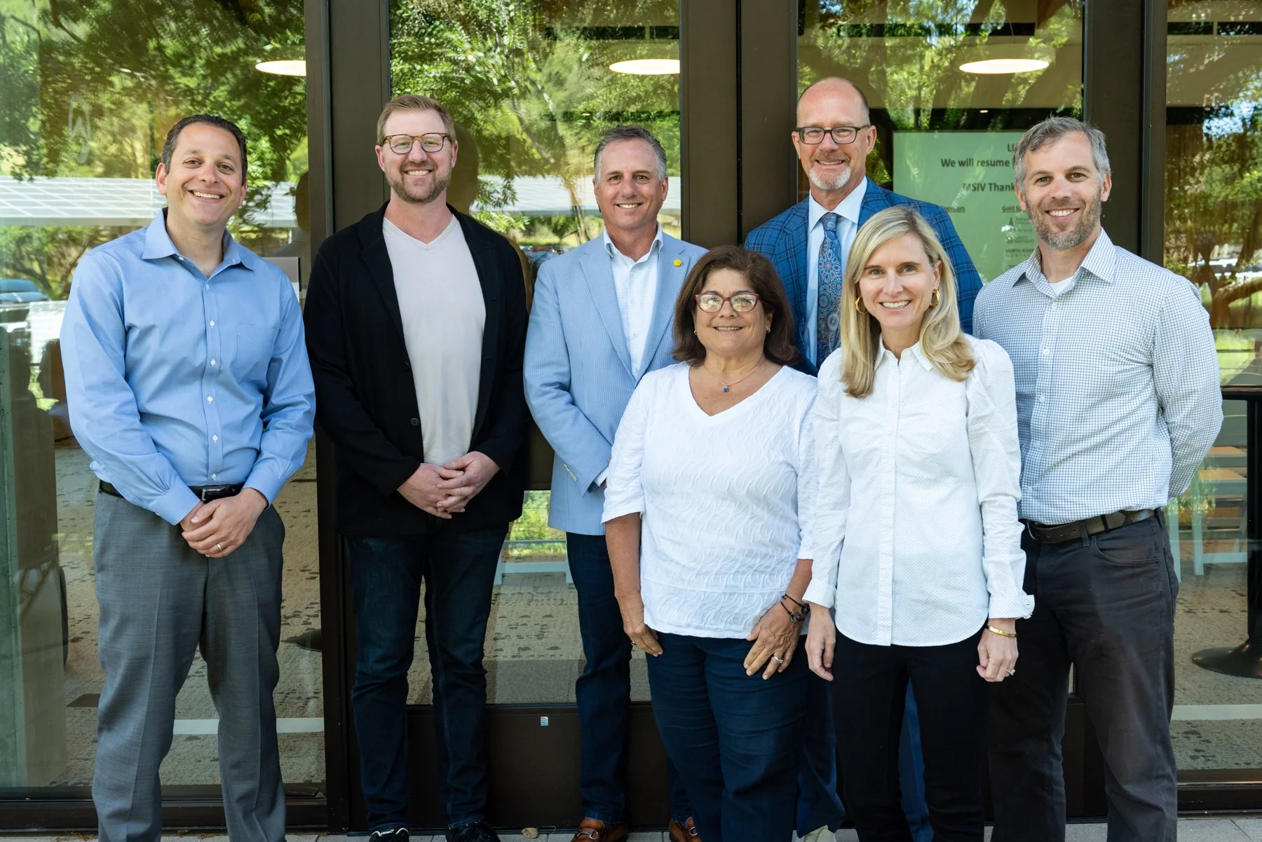 Seven MSIV team members standing outside at the North Bay NEXT conference