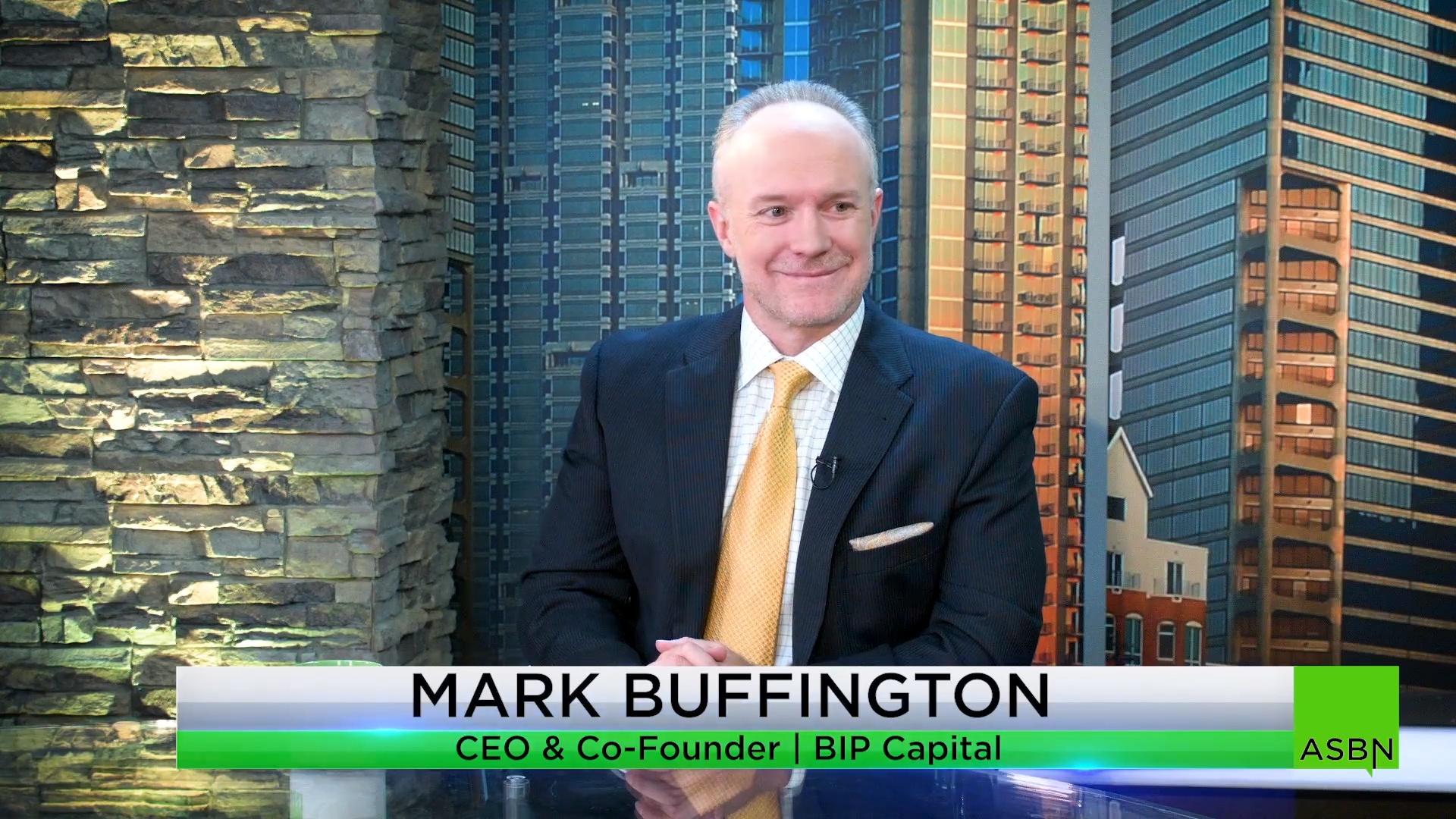 Mark Buffington seated for an ASBN television interview