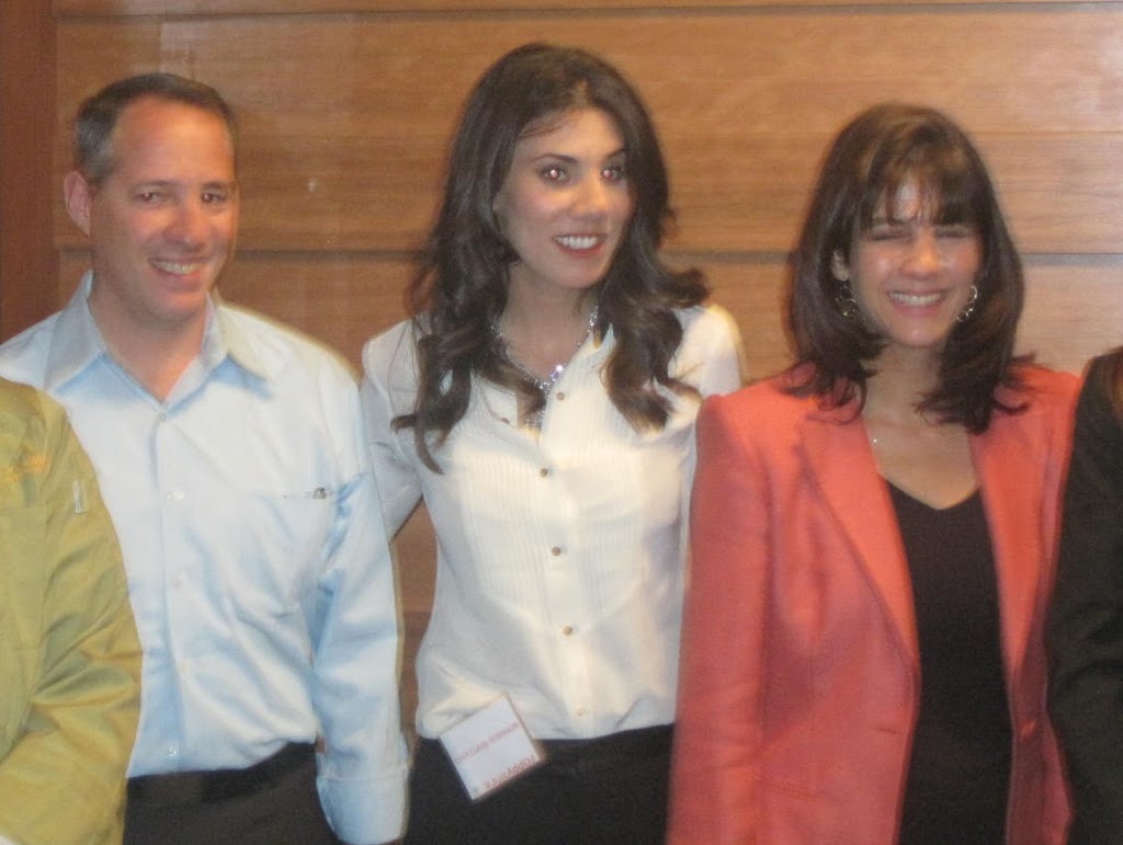 Mark Cotter, left, standing with Claire Robinson and Heidi Skolnik at the Just Add OJ event