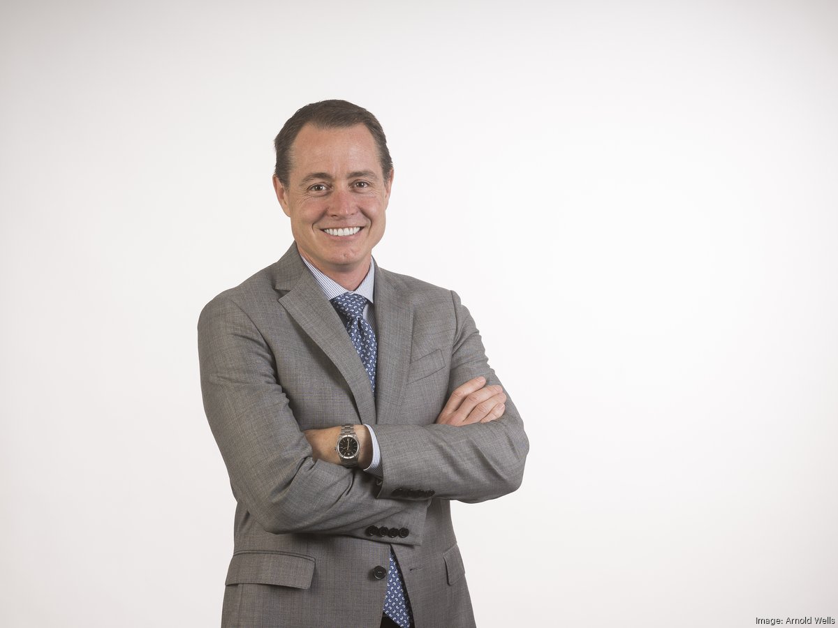 Mark Friedman in a gray suit, photographed for Austin Business Journal’s 2016 CEO coverage