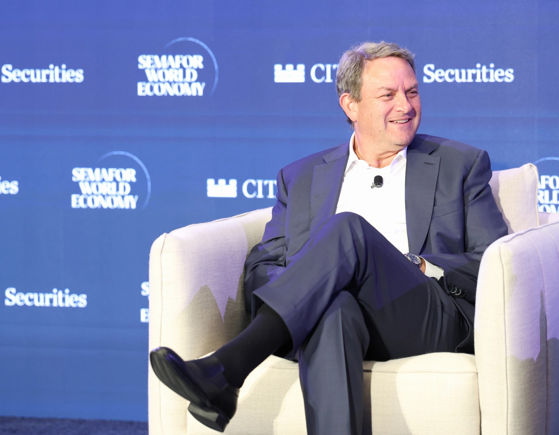 Mark Lazarus seated onstage at Semafor World Economy in Washington