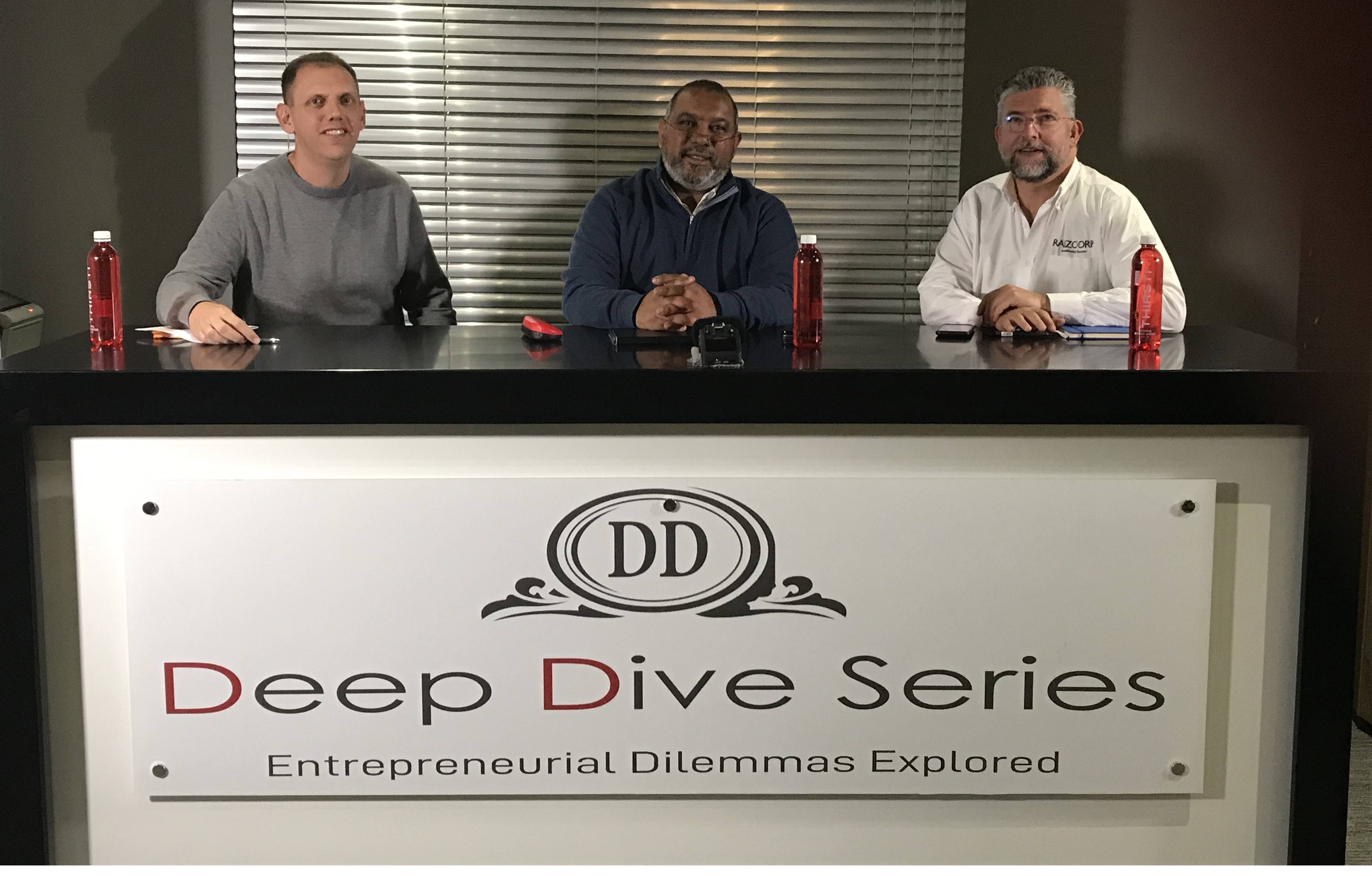 Mark Levy, left, seated at a table with Kumaran Padayachee and Allon Raiz for the Deep Dive Series