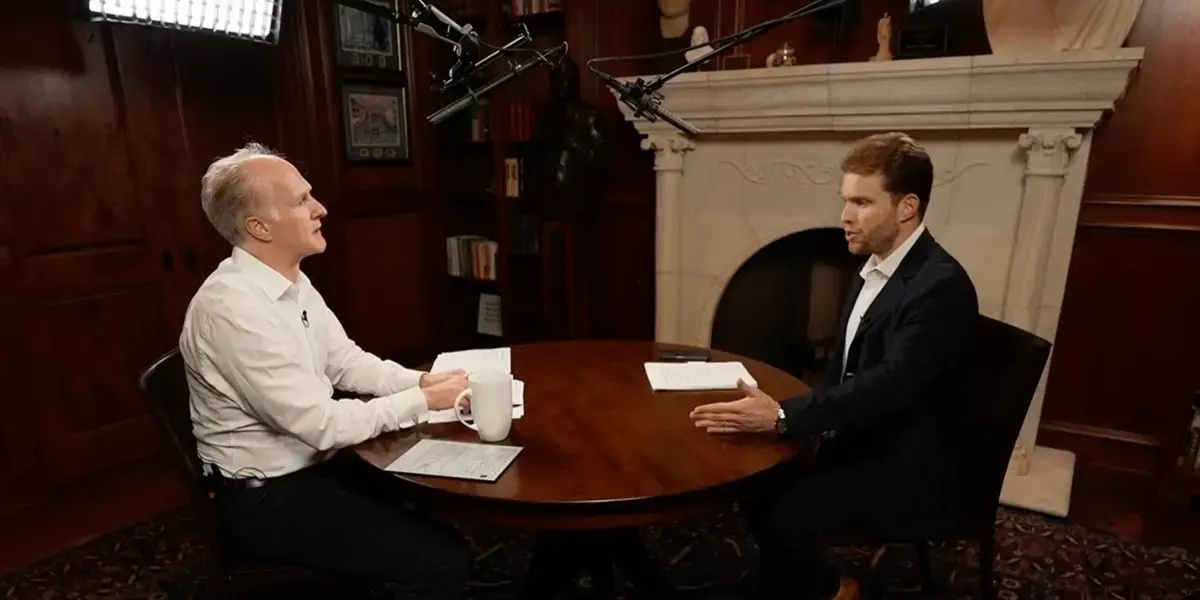 Mark Machin, left, and Joe Lonsdale talking across a table during their October 2022 interview