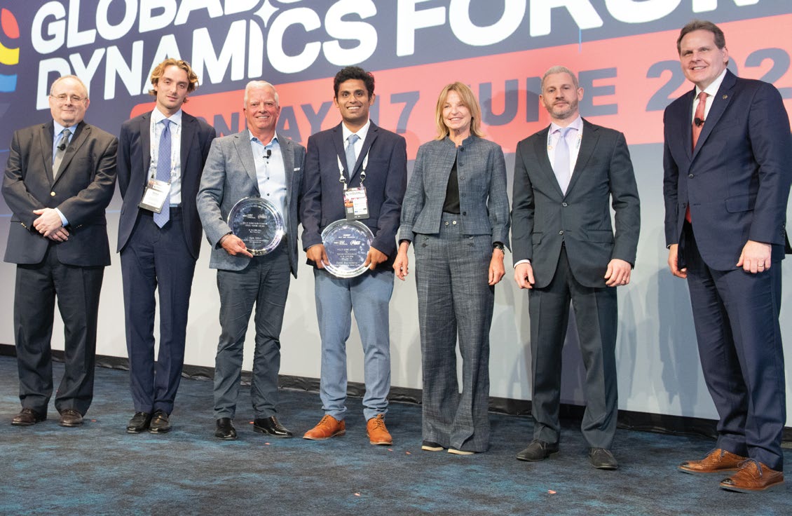 Mark Millett, third from left, holding his award alongside fellow recipient Diptak Bhattacharya and forum representatives