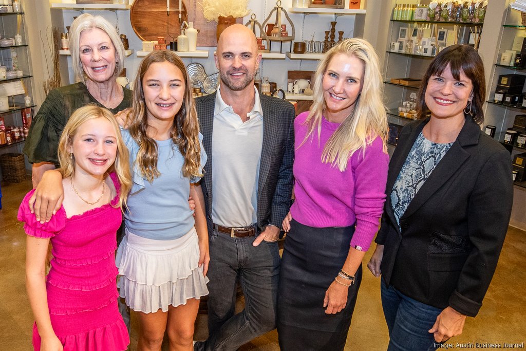 Mark Newberry with his family inside Tarrytown Pharmacy