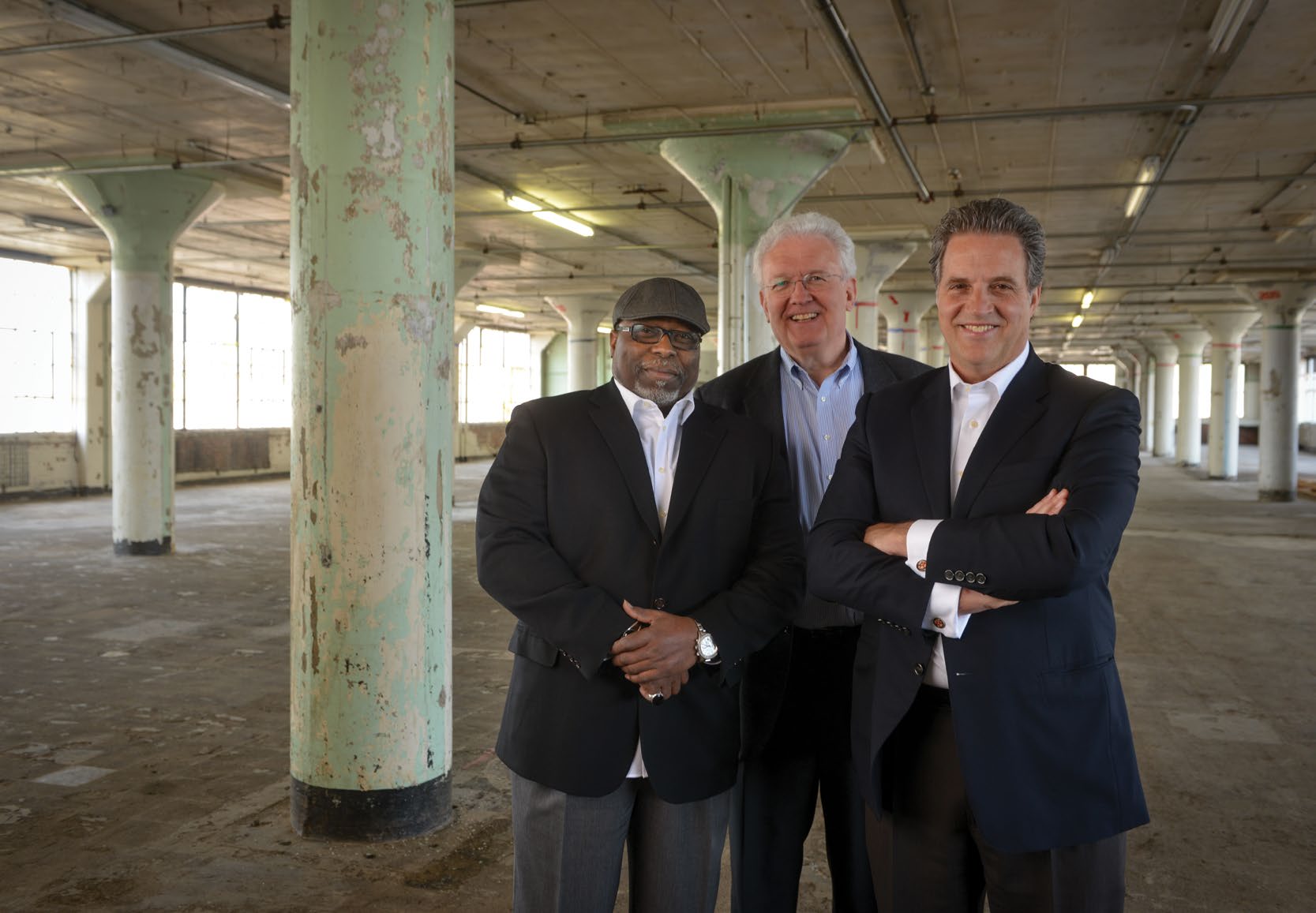 T. Rashad Byrdsong, Mark Peterson and Bill Krahe standing inside the former Westinghouse building in Homewood.