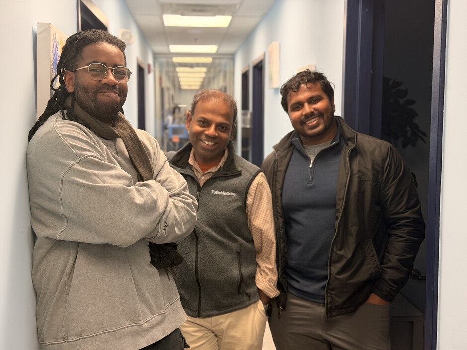 Beacon Health co-founder Obinna Akahara, customer and chief medical officer Karthik Ravindran, and co-founder Mark Pothen standing together in a practice hallway