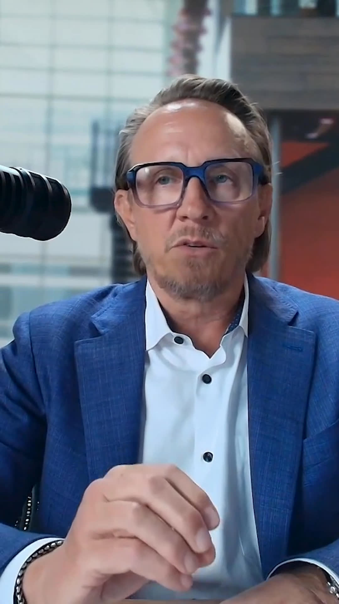 Mark Smucker speaking beside a microphone during How Leaders Lead