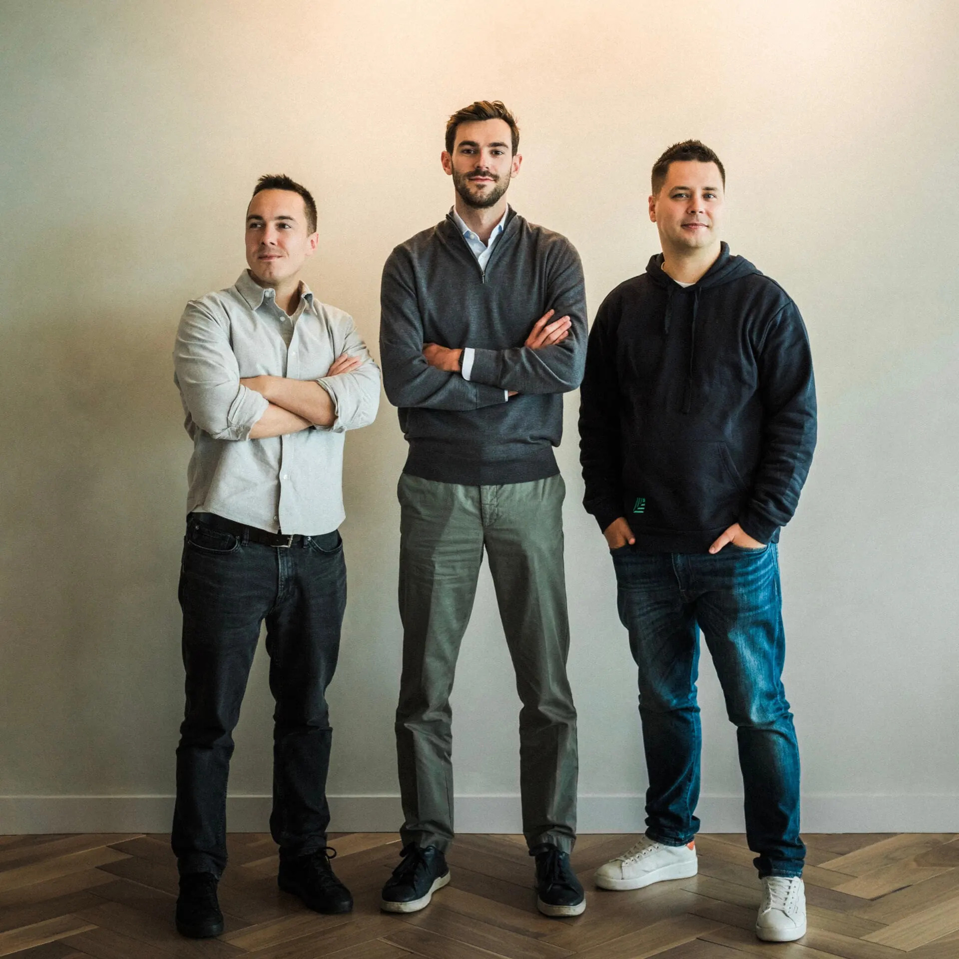 Mark Swan standing with Nevis co-founders Philipp Burda and Ivan Chalov