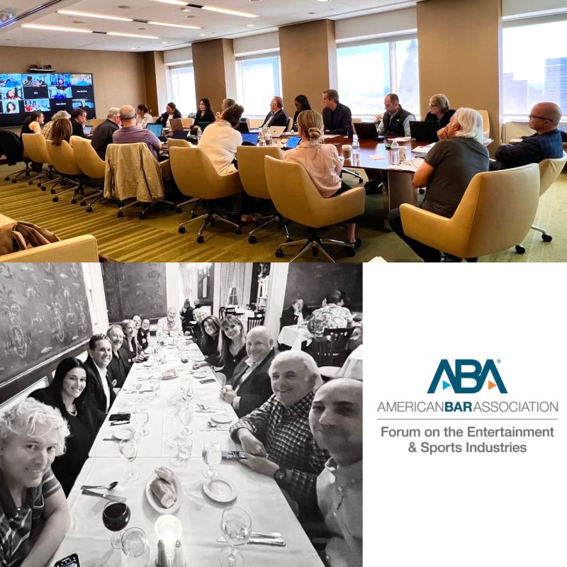 Members of the American Bar Association Forum on the Entertainment and Sports Industries meeting around a conference table and sharing a meal