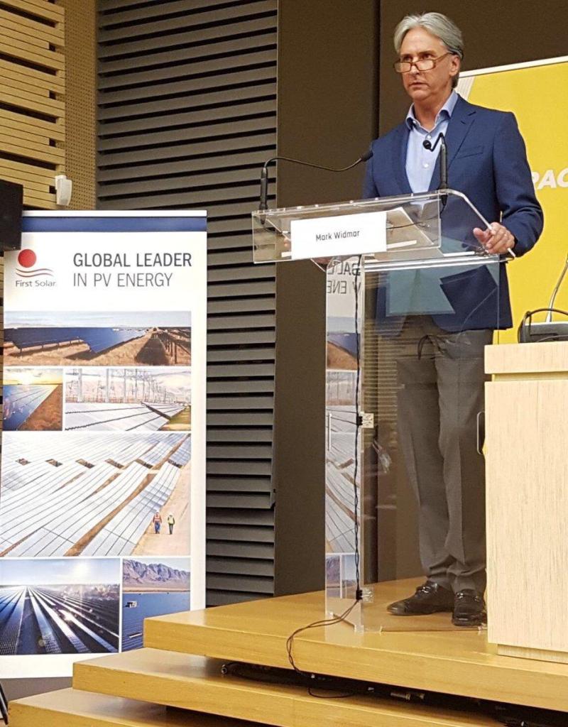 Mark Widmar speaking behind a clear lectern at a EURACTIV France solar conference