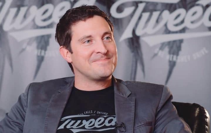 Mark Zekulin wearing a Tweed shirt and jacket during a filmed interview