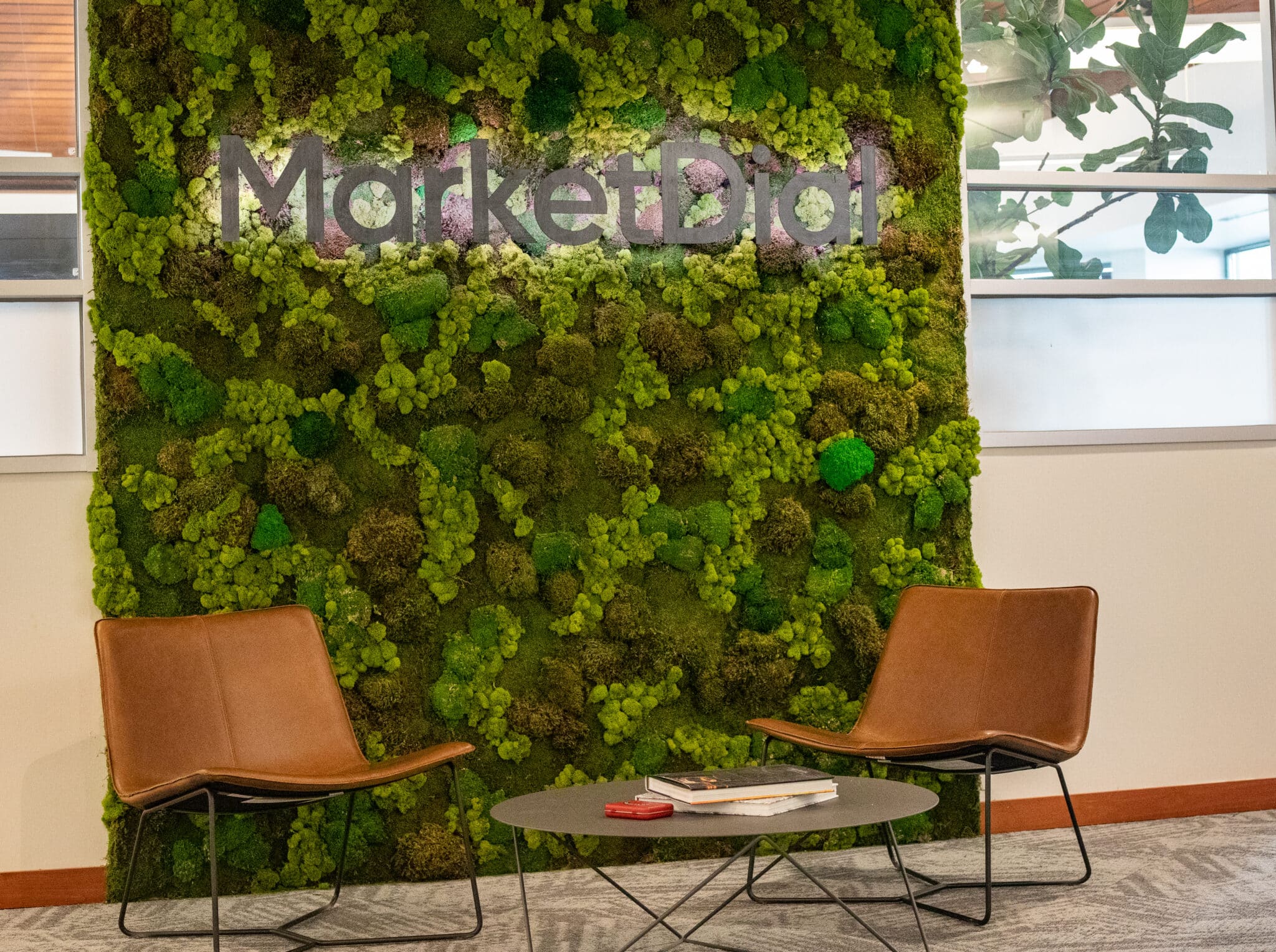 MarketDial's Salt Lake City office lobby with a living moss wall spelling the company name