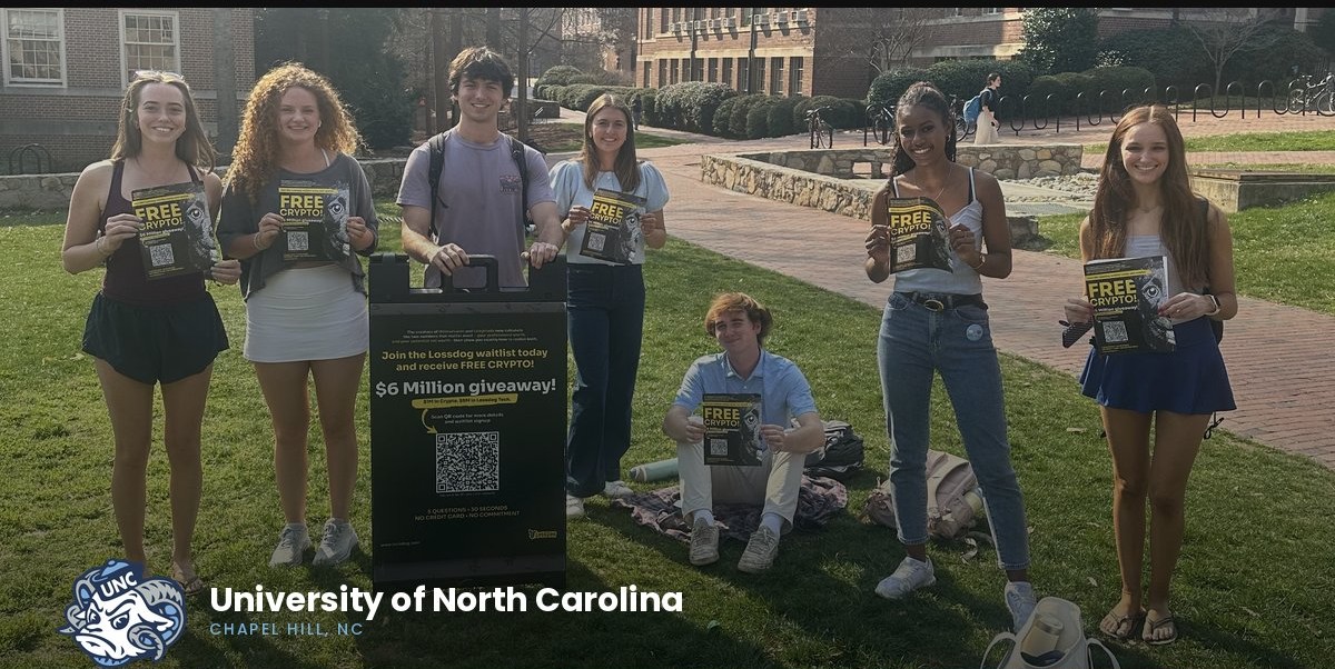 Student ambassadors holding Lossdog campaign flyers on the UNC Chapel Hill campus
