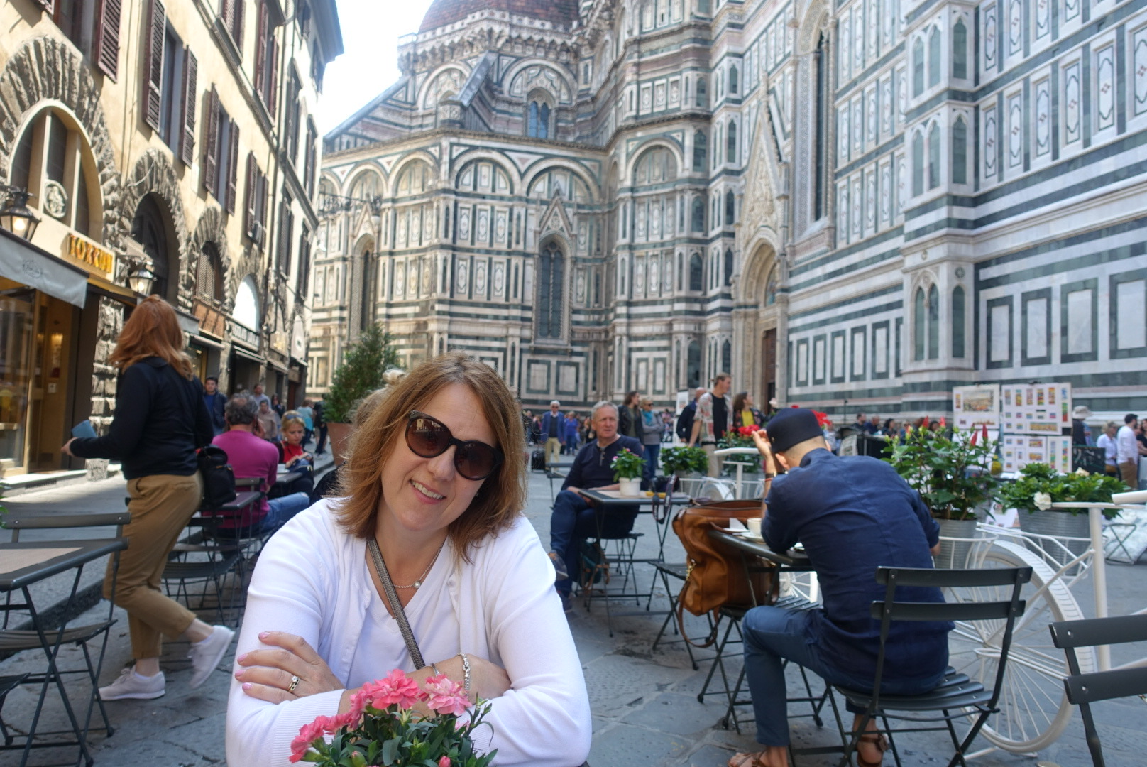 Marlene Byrne seated at an outdoor café beside Florence’s Duomo