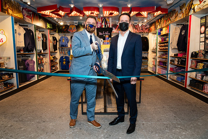Marshall Retail Group and Neon Museum representatives celebrate the airport store opening