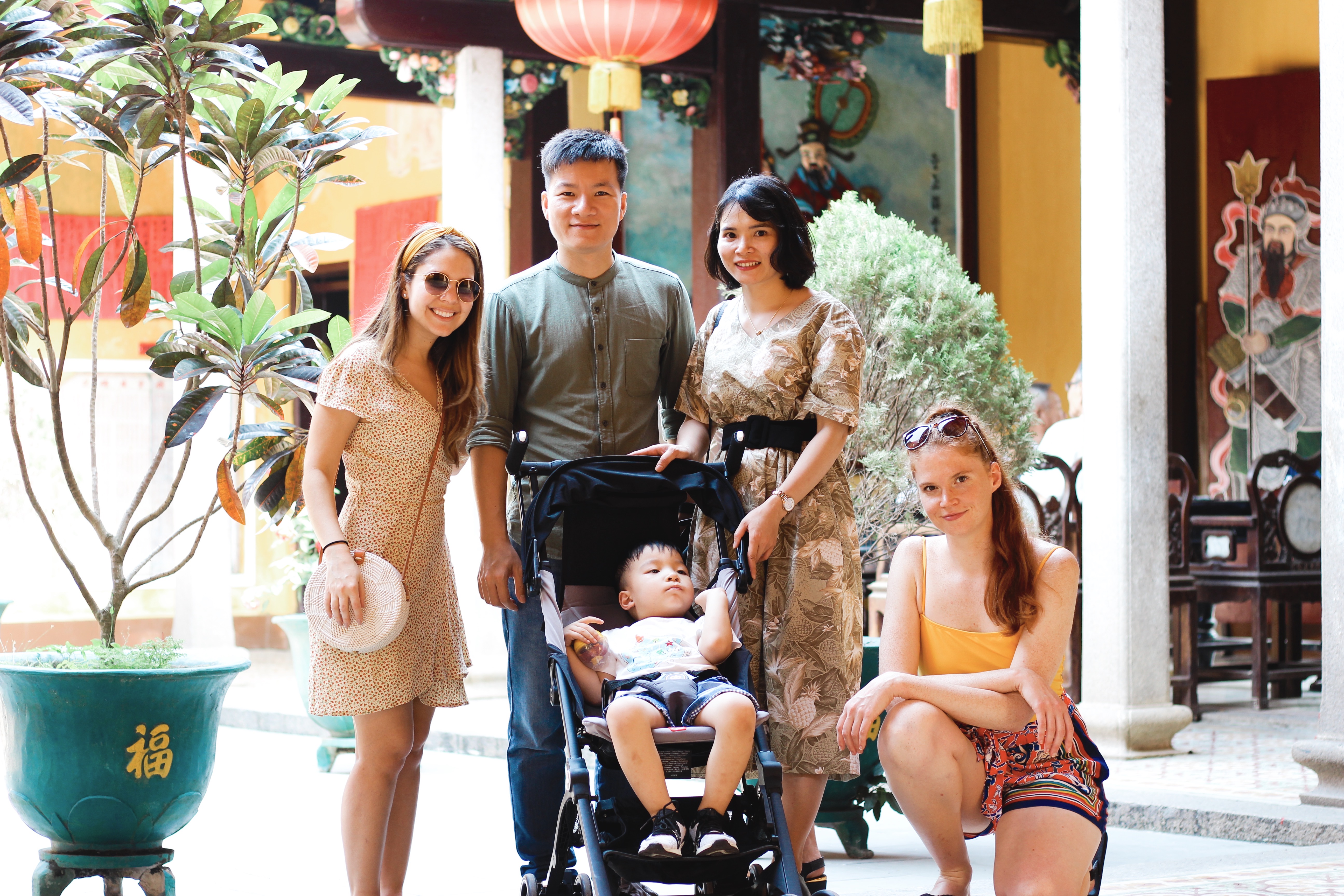 Martha Bitar at left, Trong Dong and his family in the center, and Rebecca Shostak at right, in Da Nang