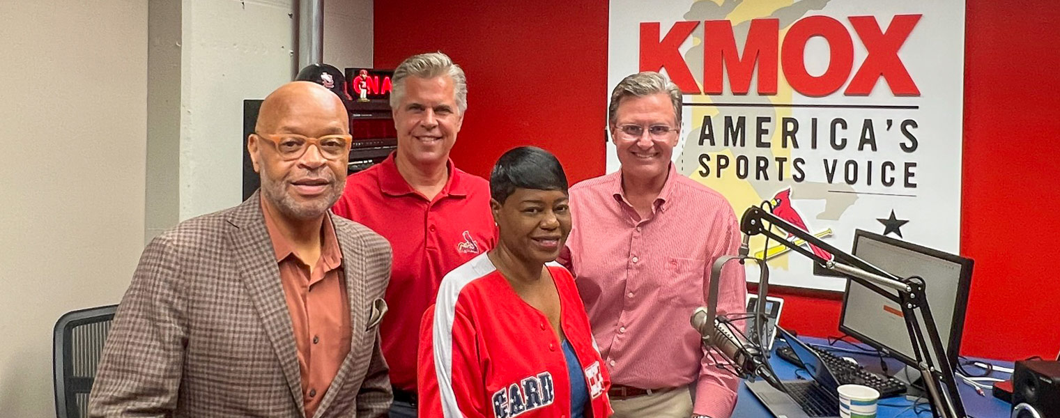 Martin Lyons, at right, with United Way campaign participants and broadcaster Mike Claiborne in the KMOX studio